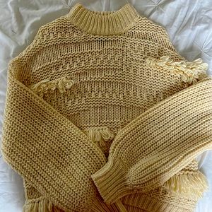 Ripped white sweater